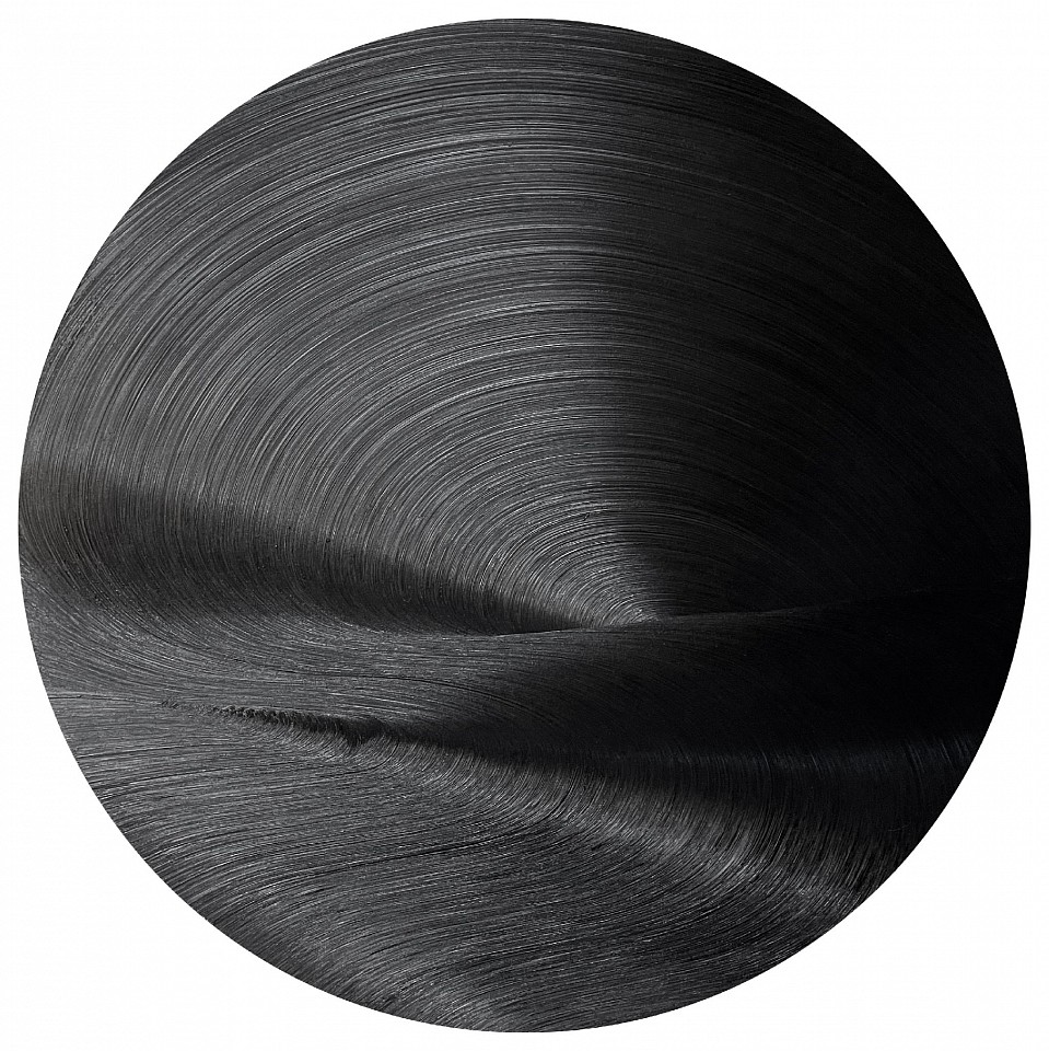 James Austin Murray, Serious Moonlight, 2021
Oil on panel, 60 x 60 in.
James Austin Murray’s Serious Moonlight (2021) is a captivating exploration of light, depth, and movement within the constraints of a monochromatic black palette. The circular oil painting radiates a hypnotic texture, with swirling brushstrokes that create an illusion of rippling waves and subtle luminescence. As light hits the surface, the oil reflects varying shades of black, transforming the work into a dynamic visual experience that shifts with the viewer’s perspective. Murray’s mastery of gesture and control over oil paint highlights his ability to create atmospheric tension and meditative calm simultaneously.

Inspired by the metaphysical properties of light and shadow, Serious Moonlight invites viewers to contemplate themes of infinity, the void, and the passage of time. The circular composition suggests cosmic energy or the orbit of celestial bodies, adding a symbolic layer to the piece’s tactile allure.

Perfect for collectors of minimalism and abstract expressionism, this painting exemplifies Murray’s unique contribution to contemporary monochrome painting.
MURR00031